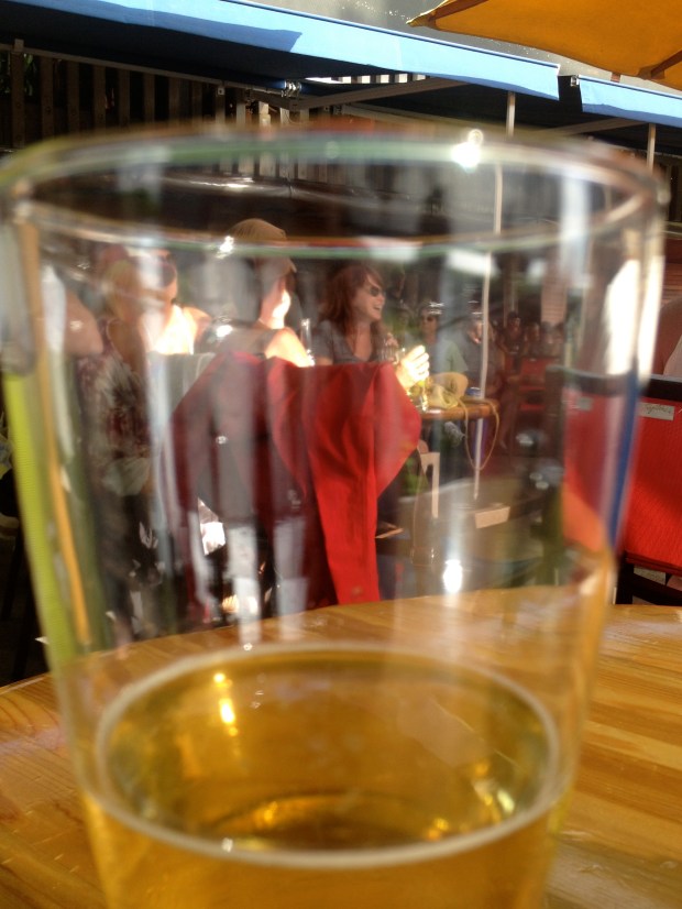 A glass half full showcases a visitor to Lelani's on the Beach, Kaanapali, Maui